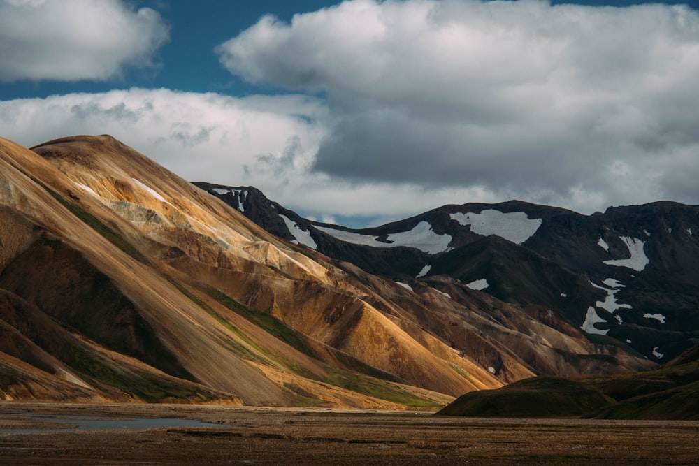 brown mountain and snowy terrain