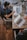man sitting on chair and looking laptop computer