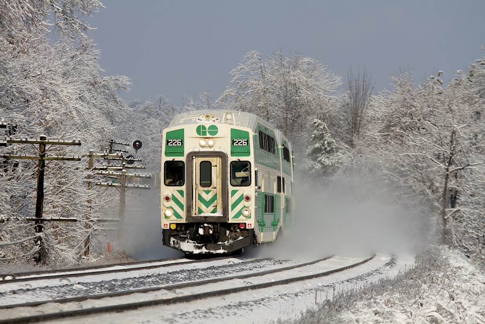 white and green train on railway during daytime