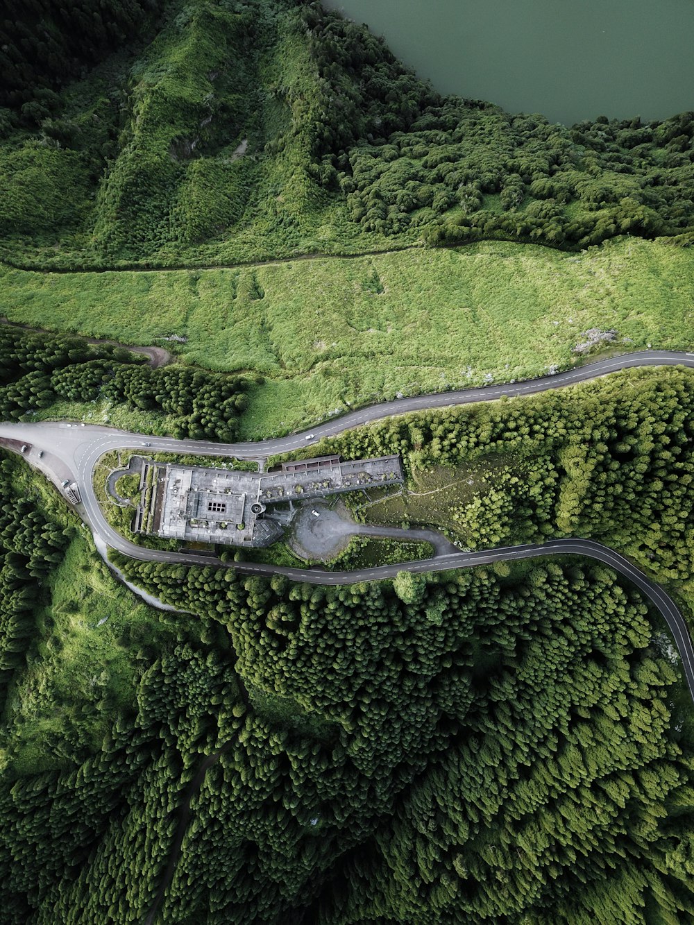 aerial view of villa surrounded by forest