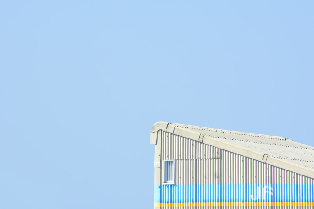 white and blue building under clear sky