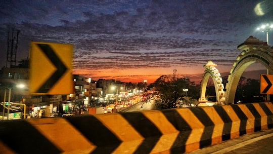 photo of road gutter during night time in Chennai India