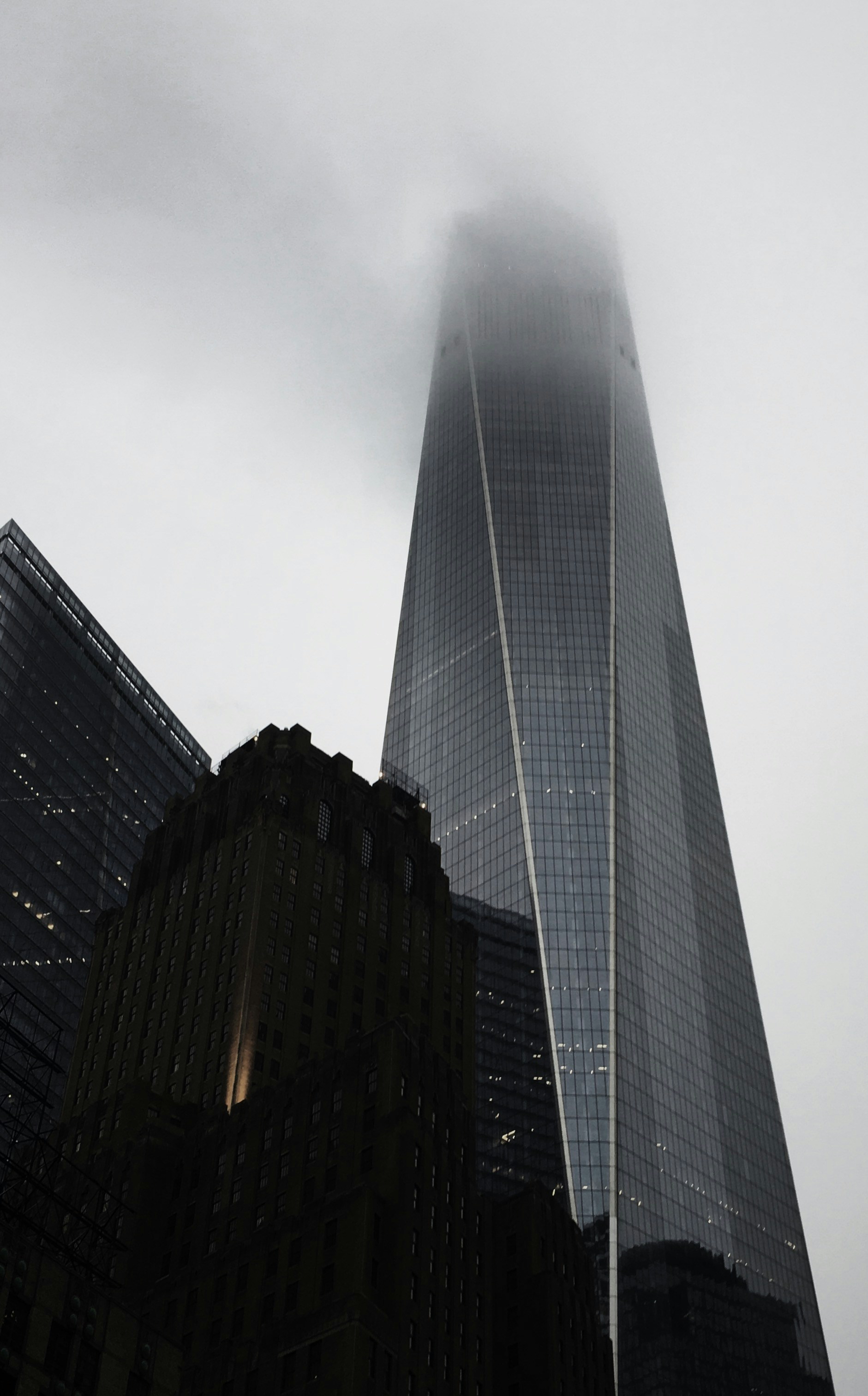 A look up shot of the world trade centre on a dreary rainy day in NYC.