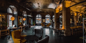 Cozy and stylish interior of 강남썸데이 쩜오 lounge at night with warm lighting.