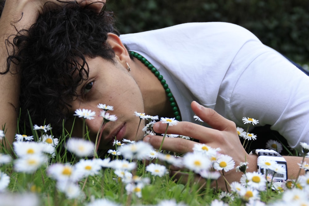 man lying down on flower bed