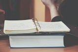 person in front of opened book