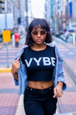 Casual urban scene with a woman confidently walking in Vyra's sporty yet elegant outfit.