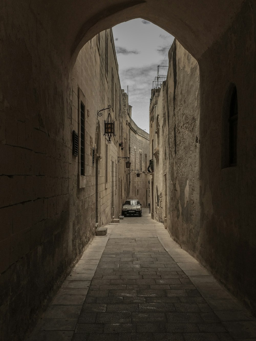 gray car in hallway during daytime