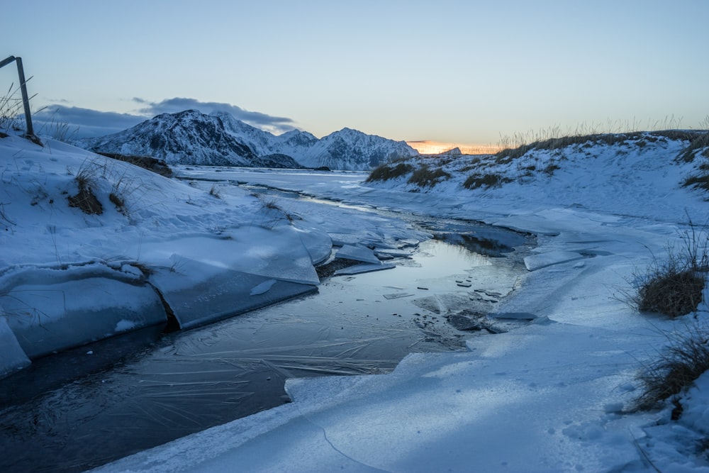 a river running through a snow covered landscape