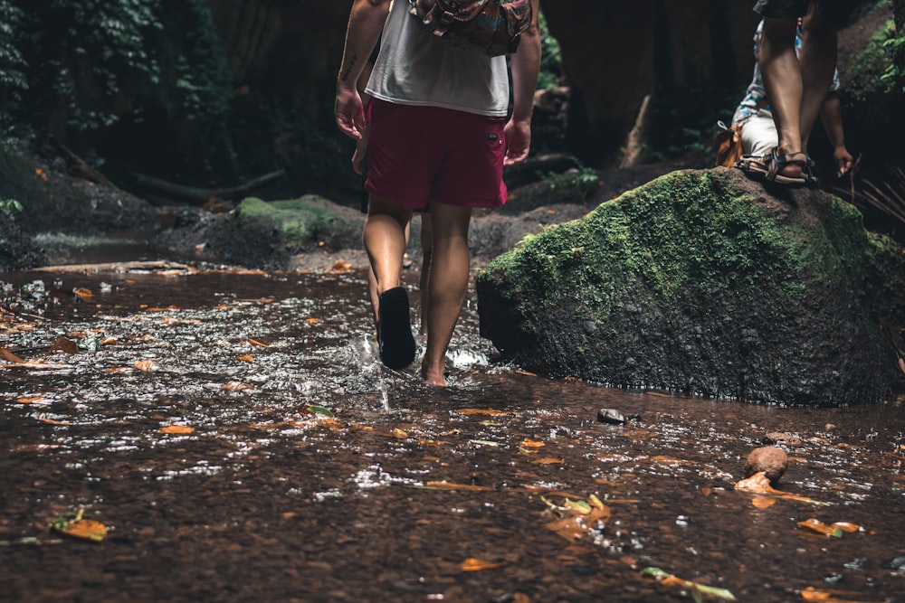 man walking on forest