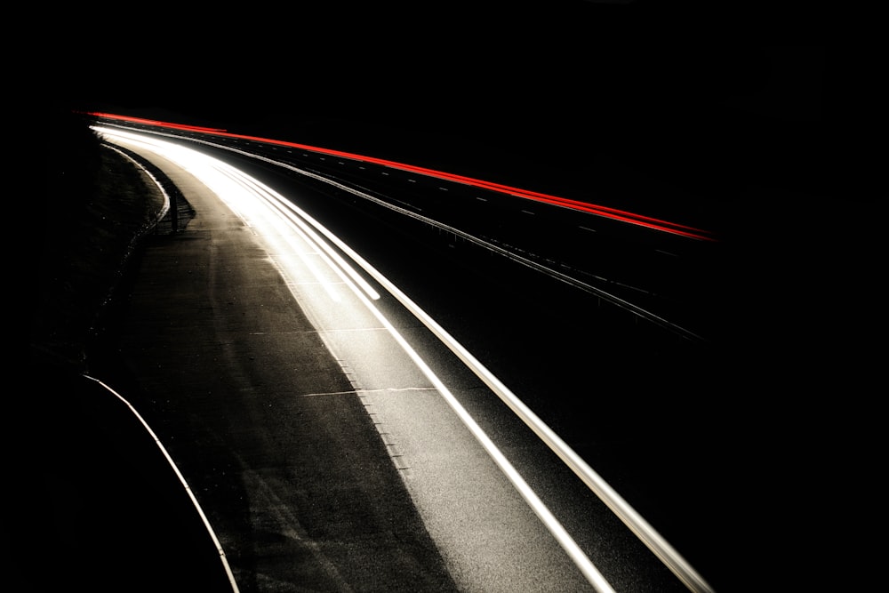 time lapse photography of vehicles on road during night