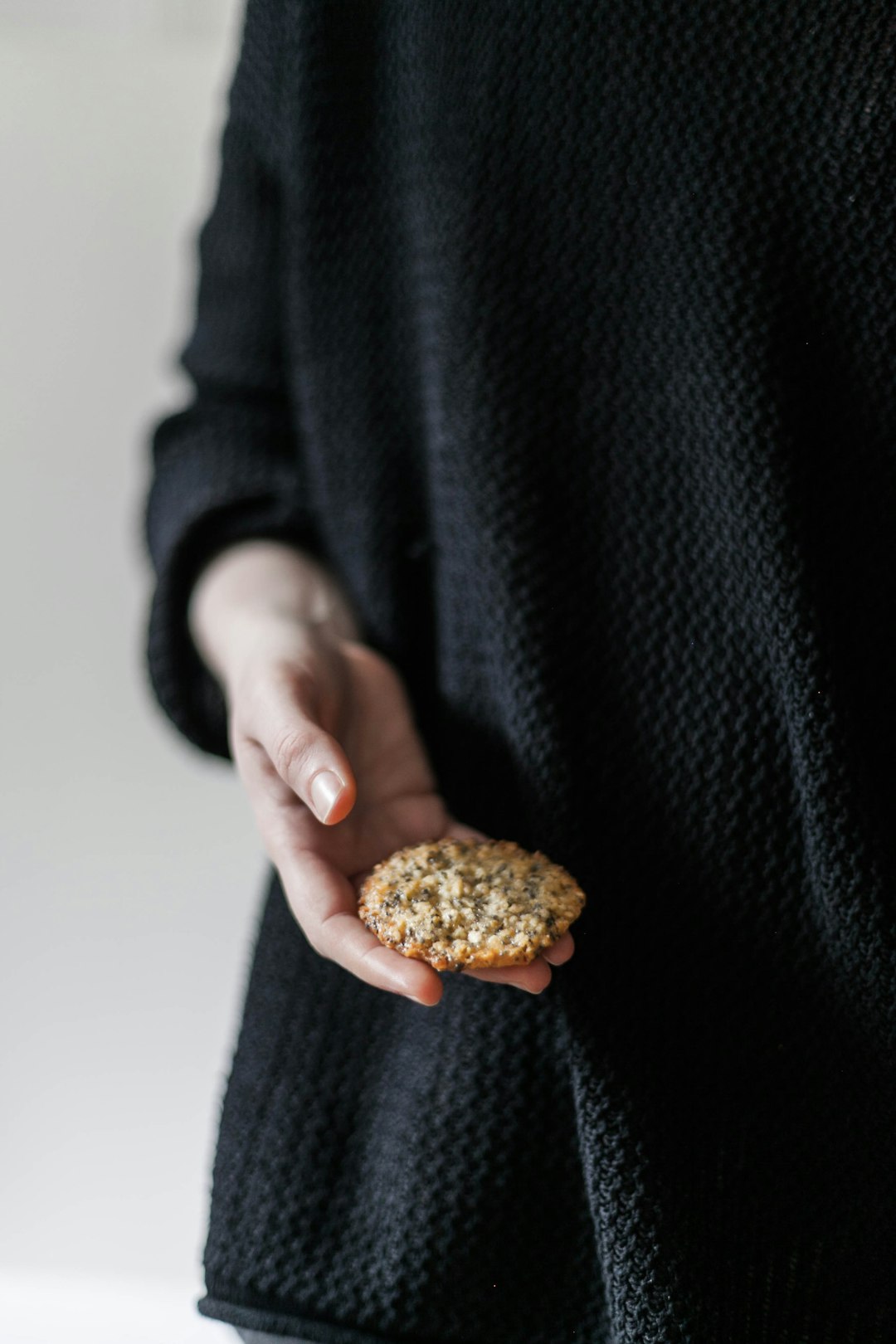 biscuit on person's hand