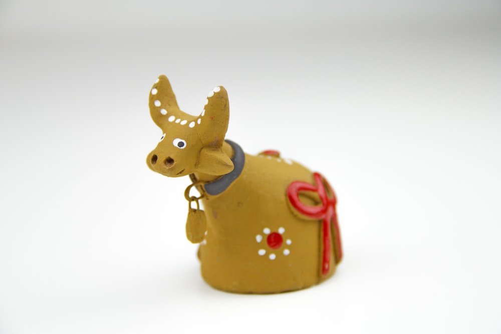 brown ceramic cow figurine