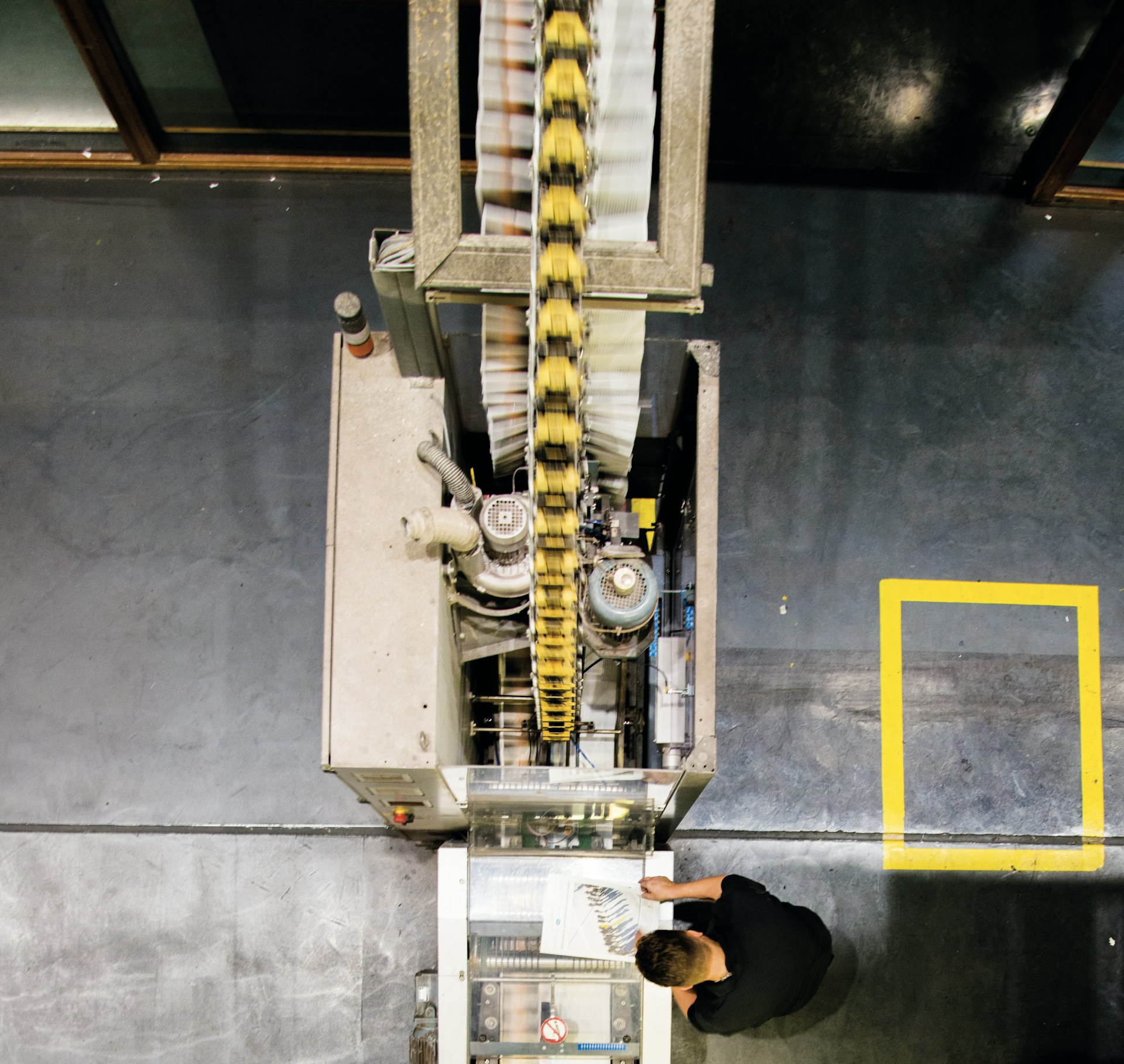 a man standing in front of a machine