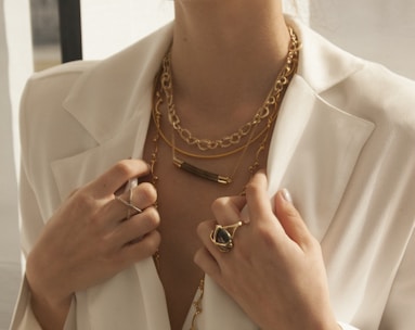 Woman confidently wearing bold semi-jewelry, showcasing modern and sophisticated style.