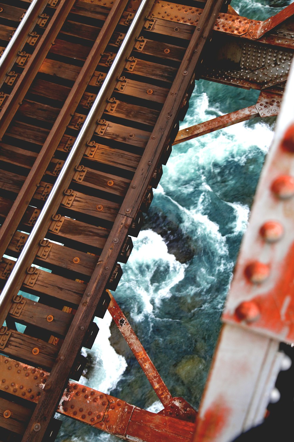 river under wooden frame during daytime