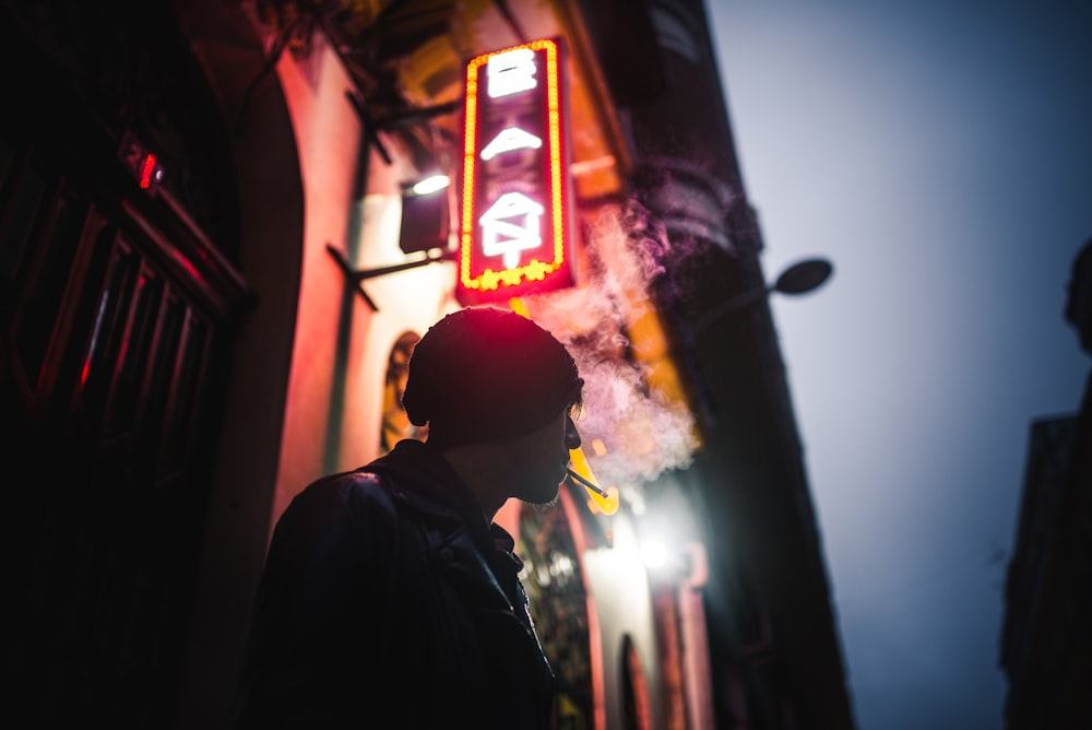 shallow focus photography of man smoking