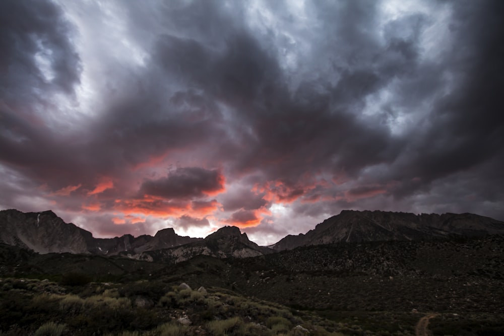 brown mountain under dark sky