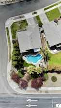 aerial photography of house with swimming pool near road