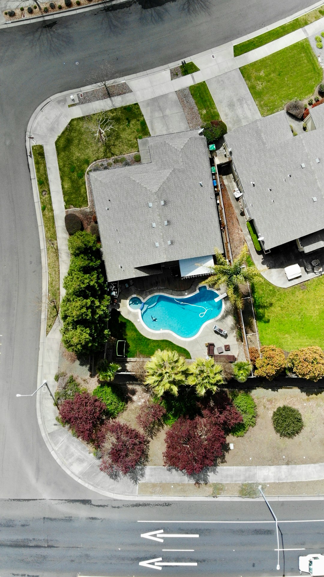 aerial photography of house with swimming pool near road