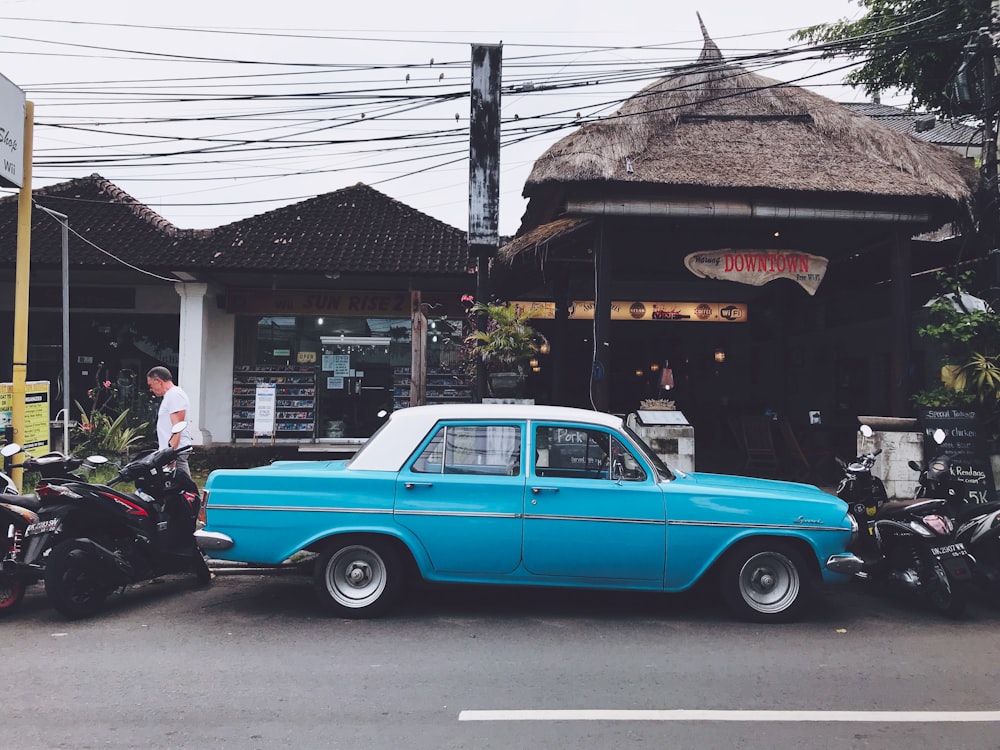 blue car parked near street