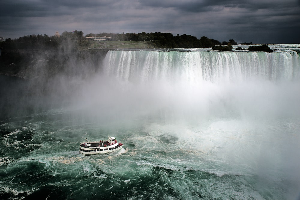 aerial photography of white and brown ship on Niagara, Canada falls during daytime