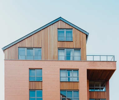 low-angle photo of brown house