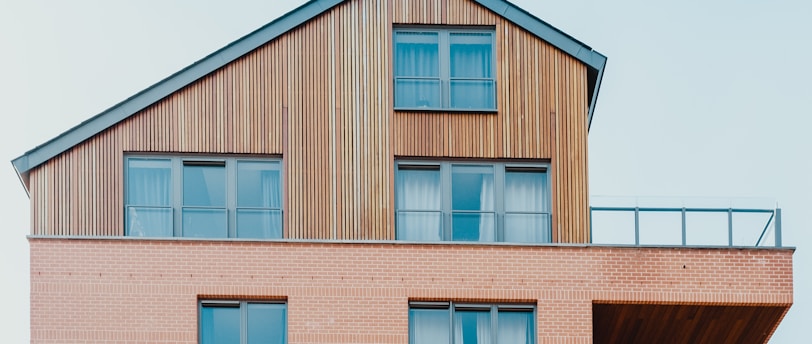 low-angle photo of brown house