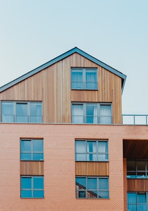 low-angle photo of brown house