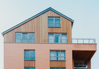 low-angle photo of brown house