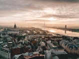 aerial photo of city under cloudy sky