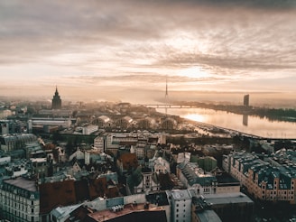 aerial photo of city under cloudy sky