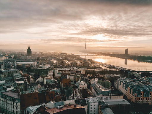 aerial photo of city under cloudy sky