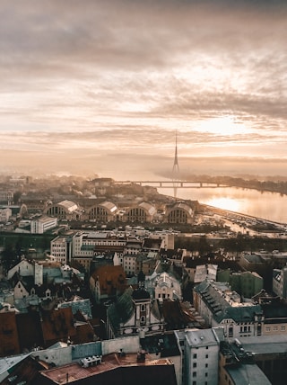 aerial photo of city under cloudy sky