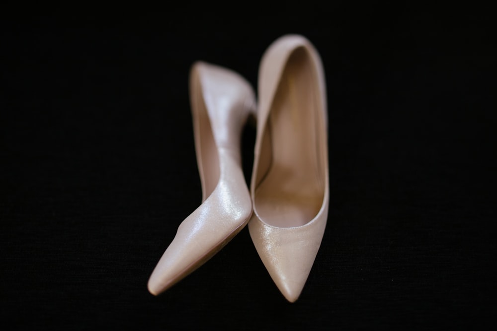 pair of women's white stilettos