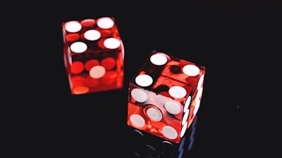 two red-and-white dices