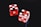 two red-and-white dices