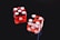 two red-and-white dices
