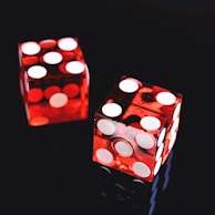 two red-and-white dices