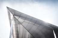 Finished metal pavilion at sunset, showing clean geometry and durable materials.