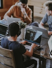 group of people using laptop computer