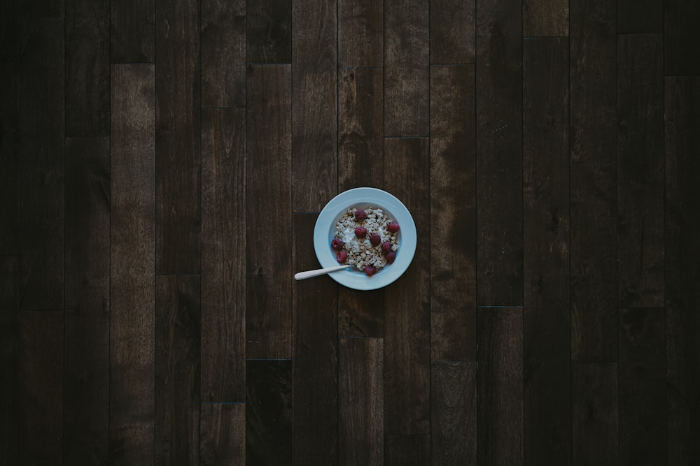 a bowl of cereal on a wooden table