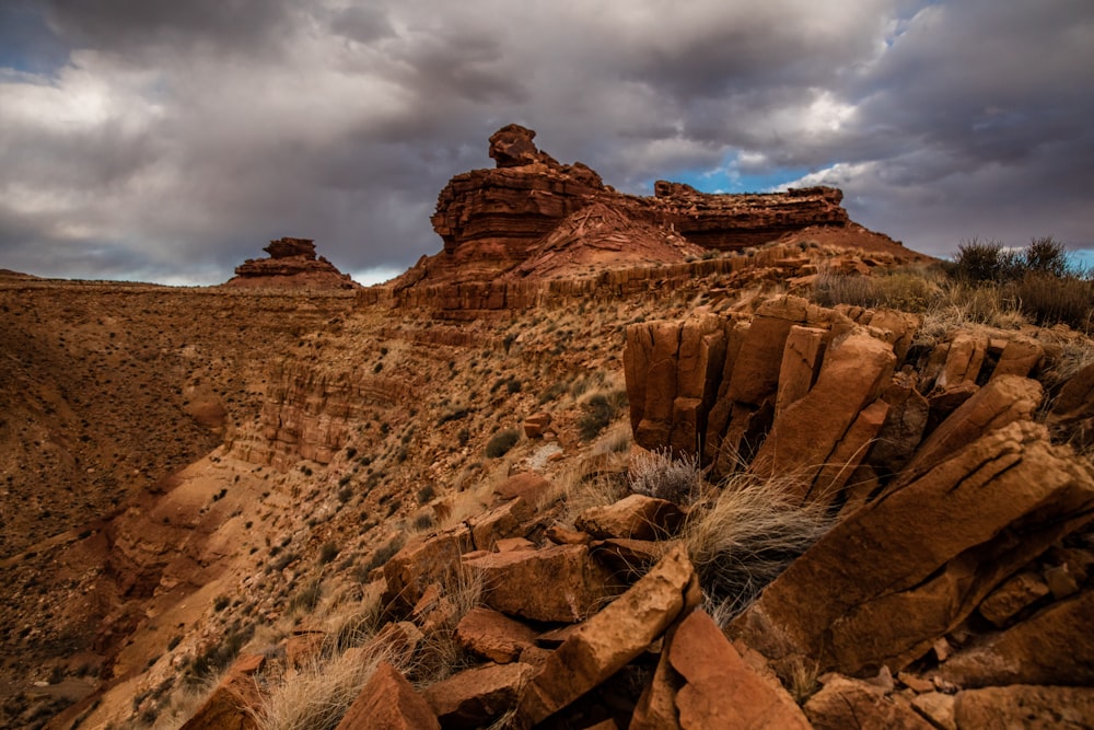 brown rocky mountain under cloudy sky during daytime