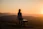 woman sitting on bench over viewing mountain