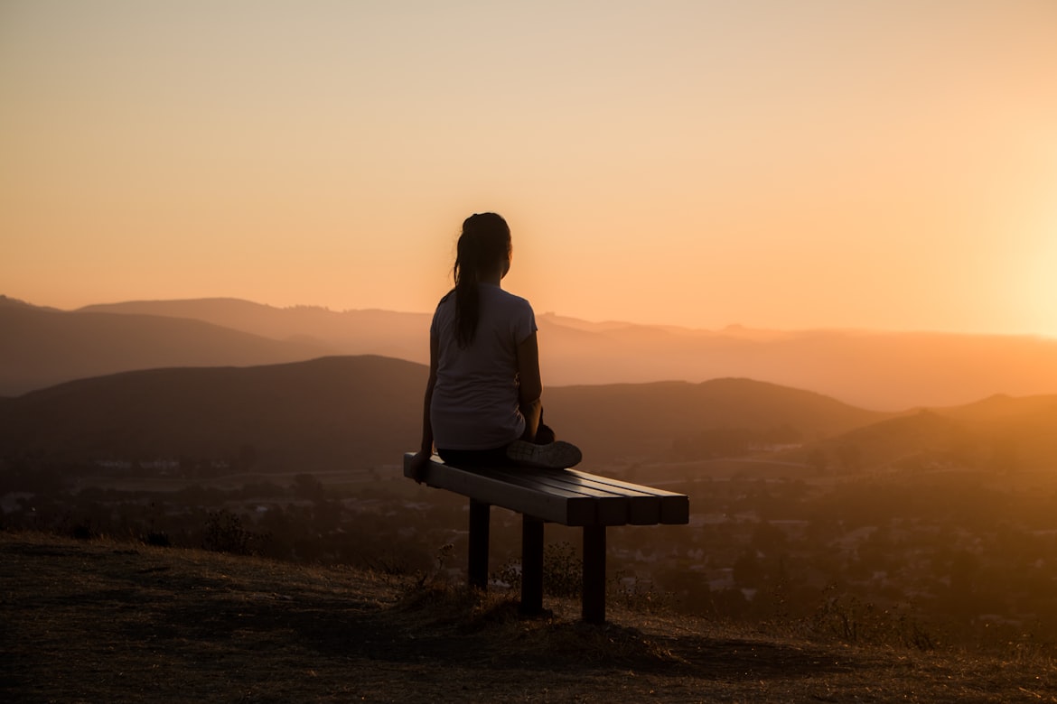 a woman watching the sunset.