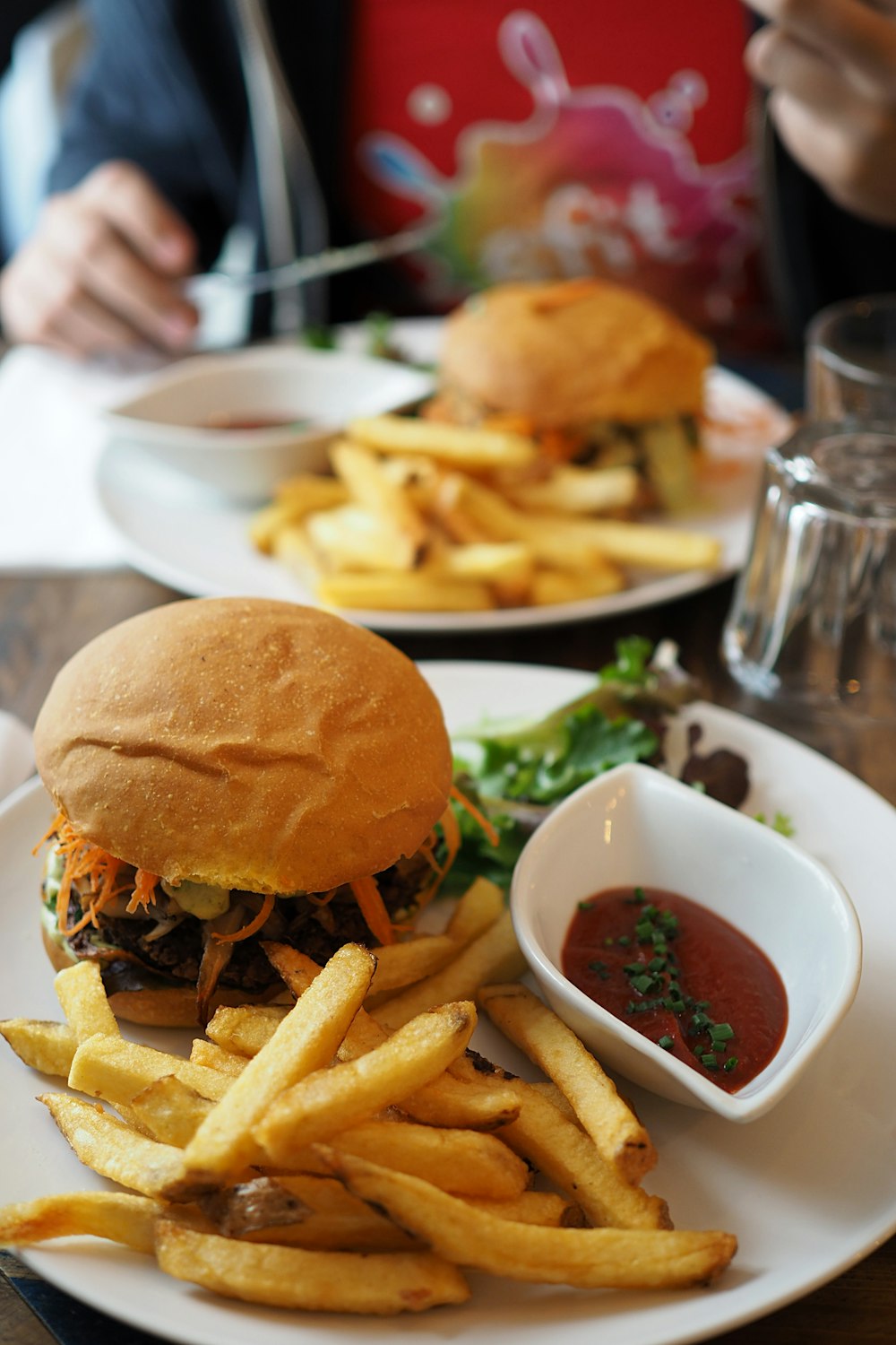 burger with potato fries and sauce