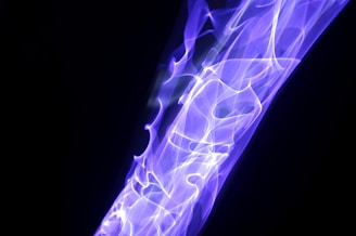 Abstract flowing energy waves in violet and indigo hues representing vital bioenergy.