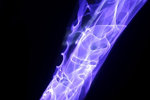 An abstract representation of energy waves in purple hues.
