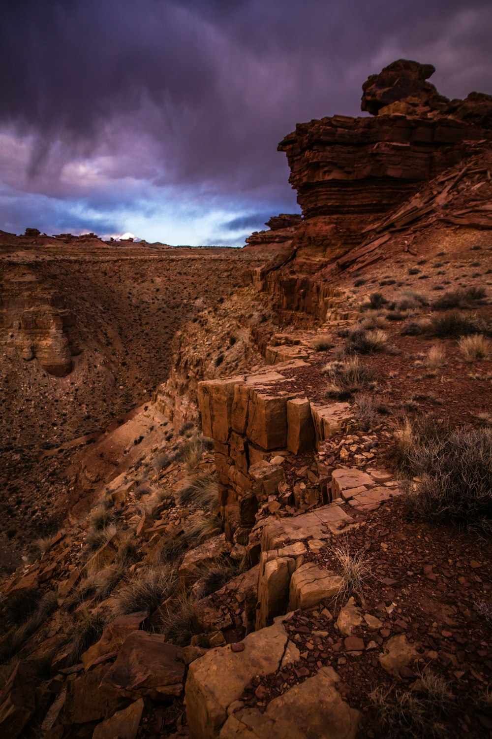 brown canyon under gray clouds at daytime