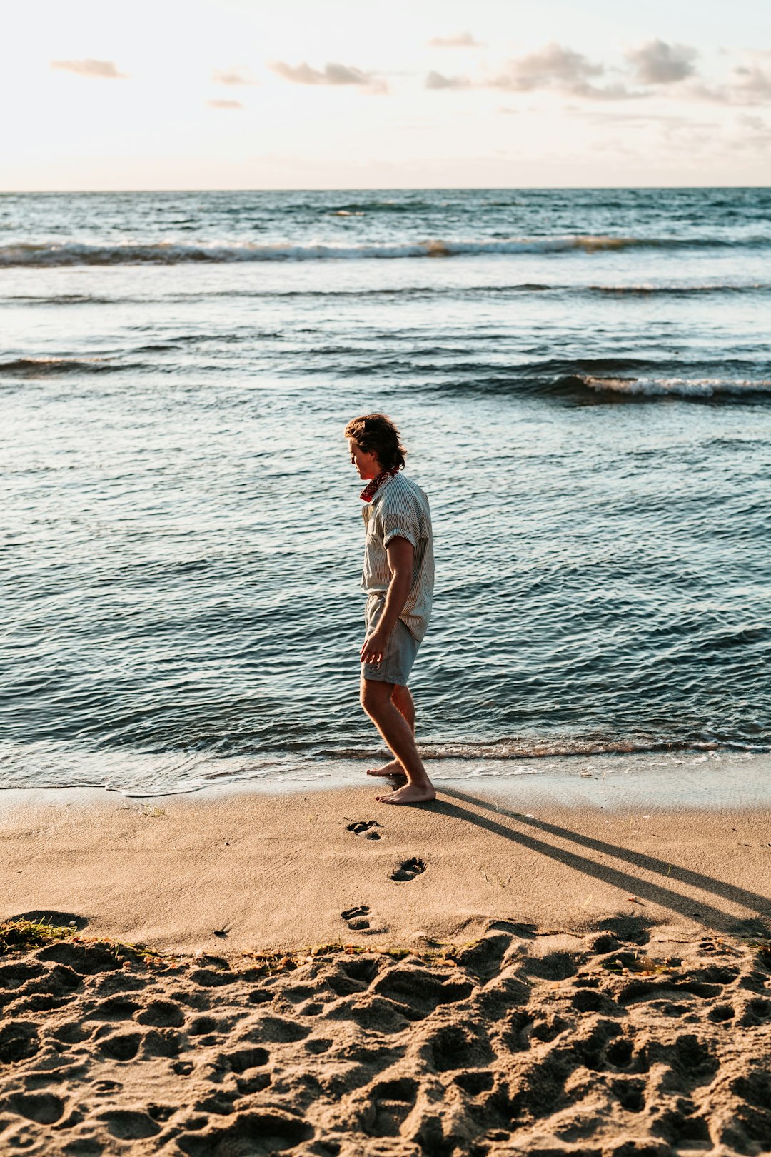 man standing on seashore